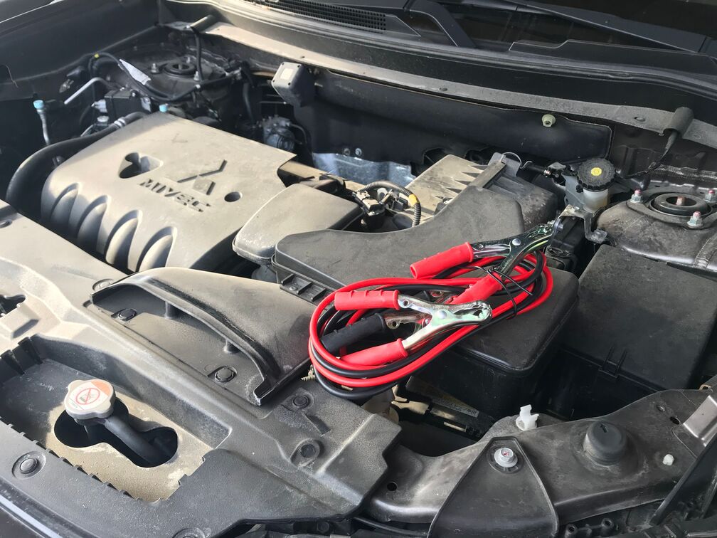 Car emergency jump starter in use